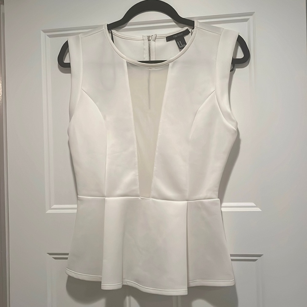 White peplum blouse with sheer plunge